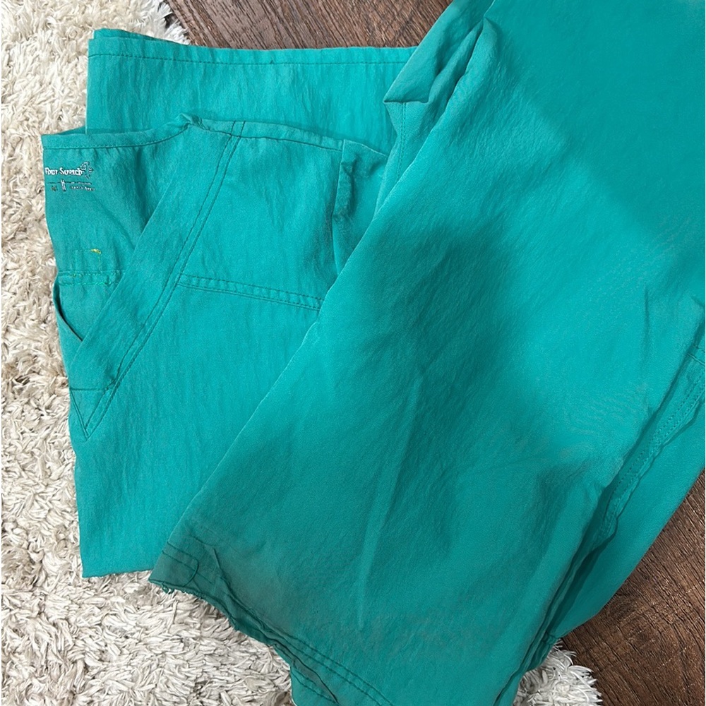 Women’s size medium, regular length, “Wonder wink-4 stretch” scrubs. Smoke free.